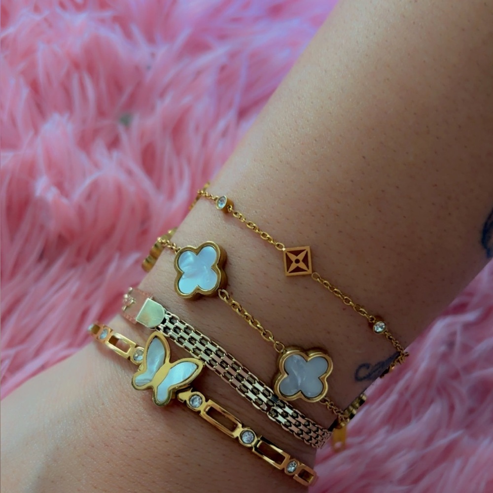 Gold and White Charm Bracelets